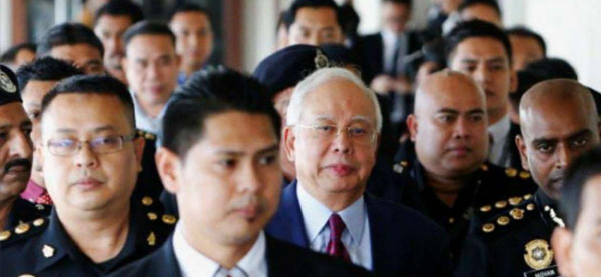 Former Malaysian PM Najib Razak pleads not guilty to breach of trust, abuse of power