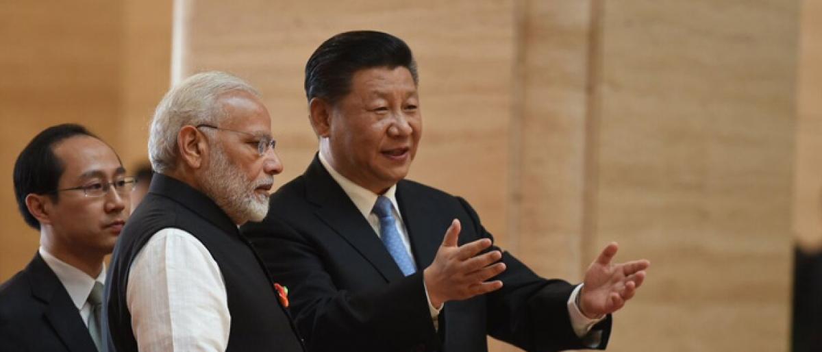 Xi meets Modi, eyes new chapter in ties