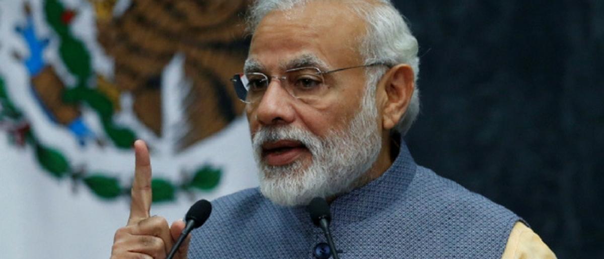 PM Modi warns of tough action against black money hoarders