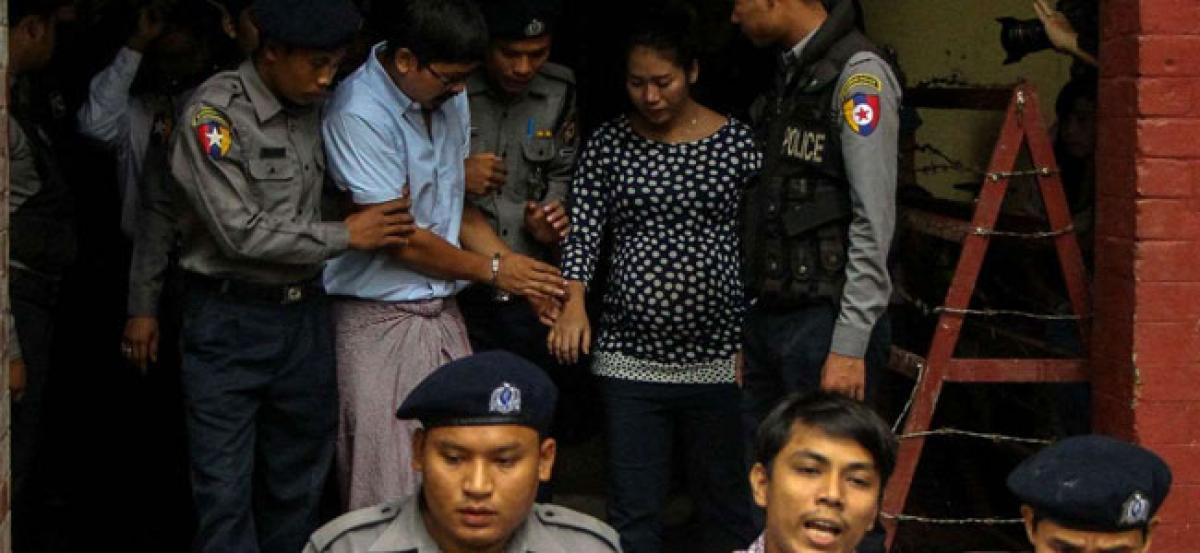 Myanmar court charges Reuters reporters under Official Secrets Act