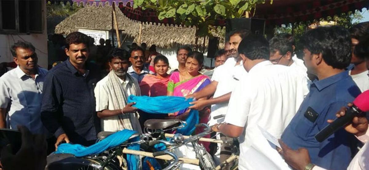 Mummidivaram MLA Datla Subba Raju distributes fishing nets, bicycles