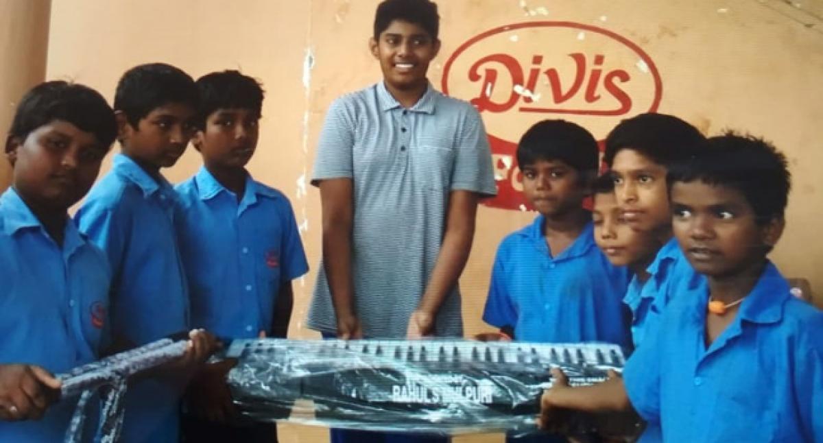 NRI provides musical instruments to school