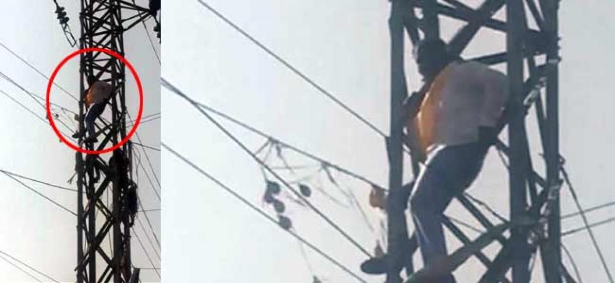 TDP worker climbed electric pole at NTR Trust Bhavan