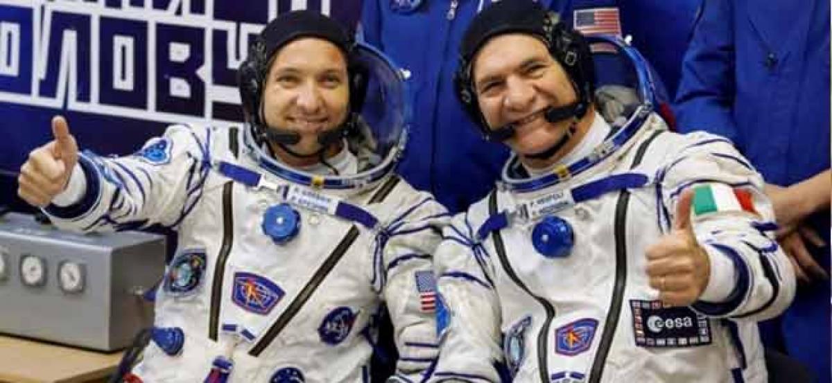 Three-man crew reaches space station as U.S. boosts research