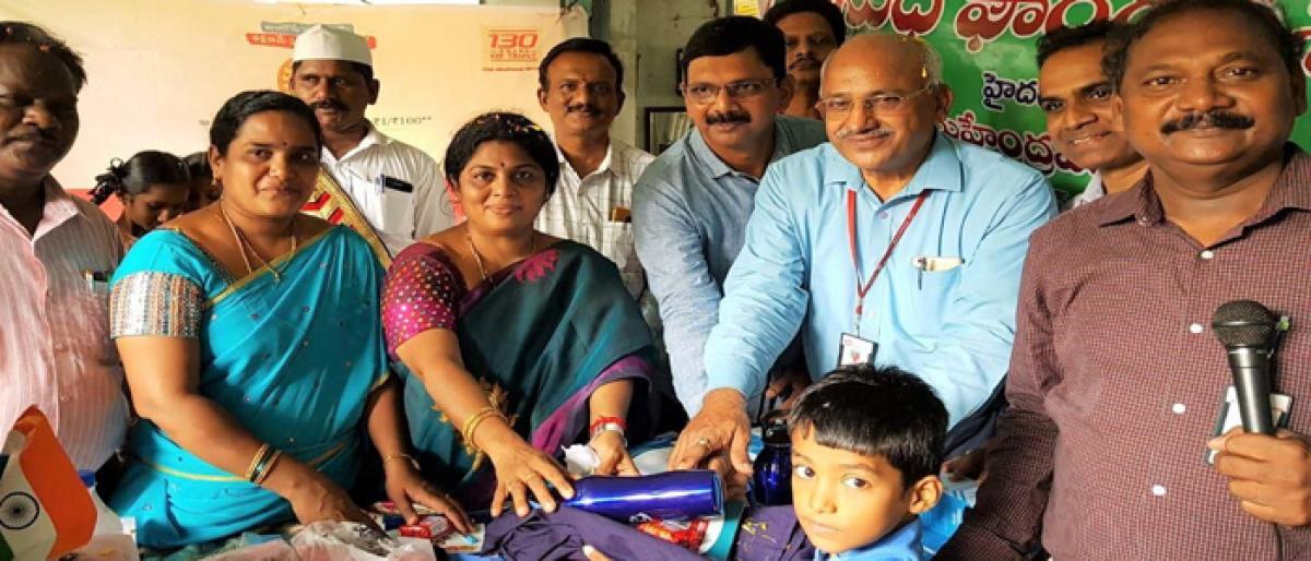 Notebooks distributed to students in Rajamahendravaram