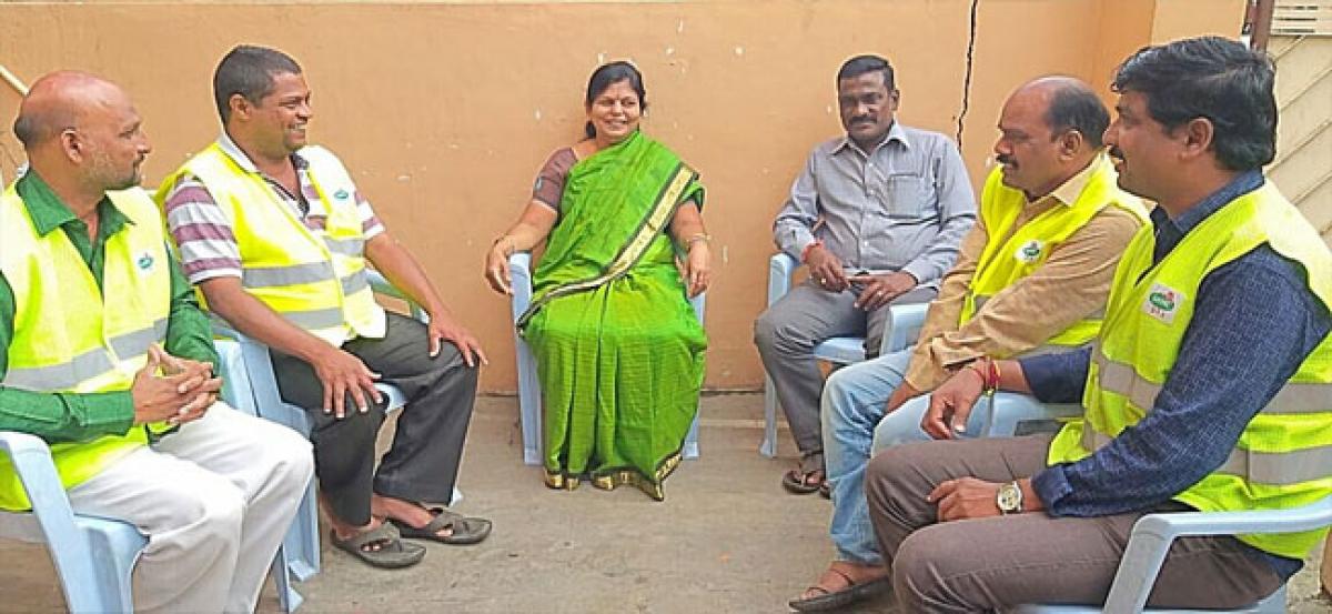 Corporator Padma interacts with sanitary workers