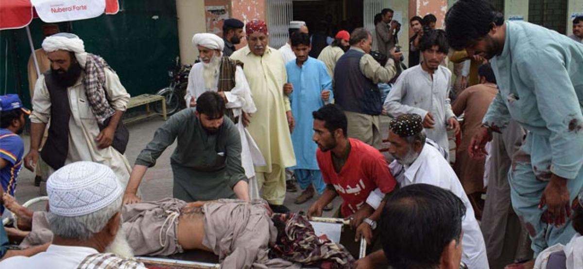 Bomb on Pakistan election campaign event kills 27 amid tension as ex-PM Sharif returns