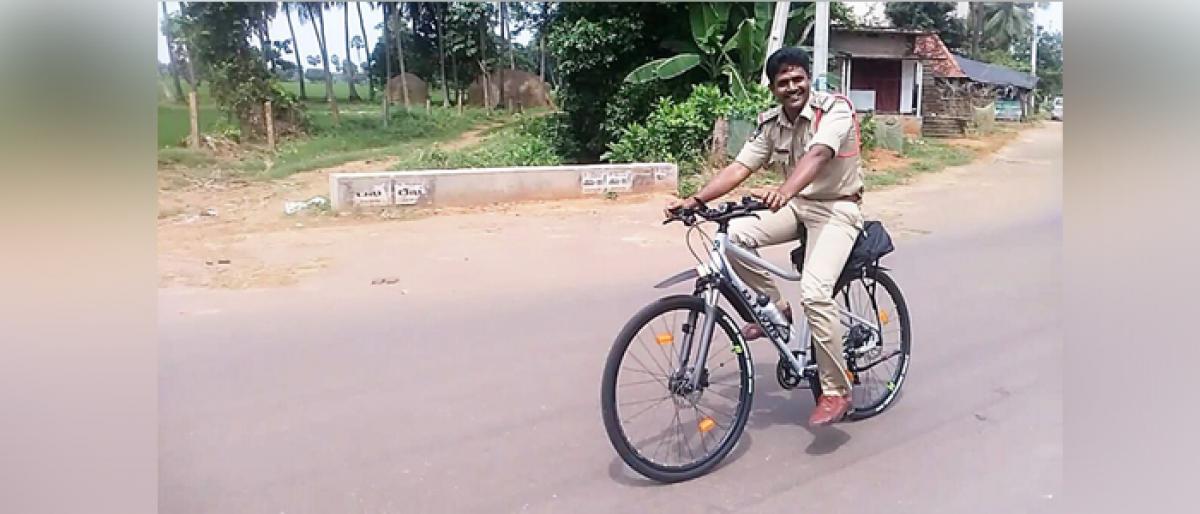Cop B Krishnamachary who cycles his way around at U Kothapalli station