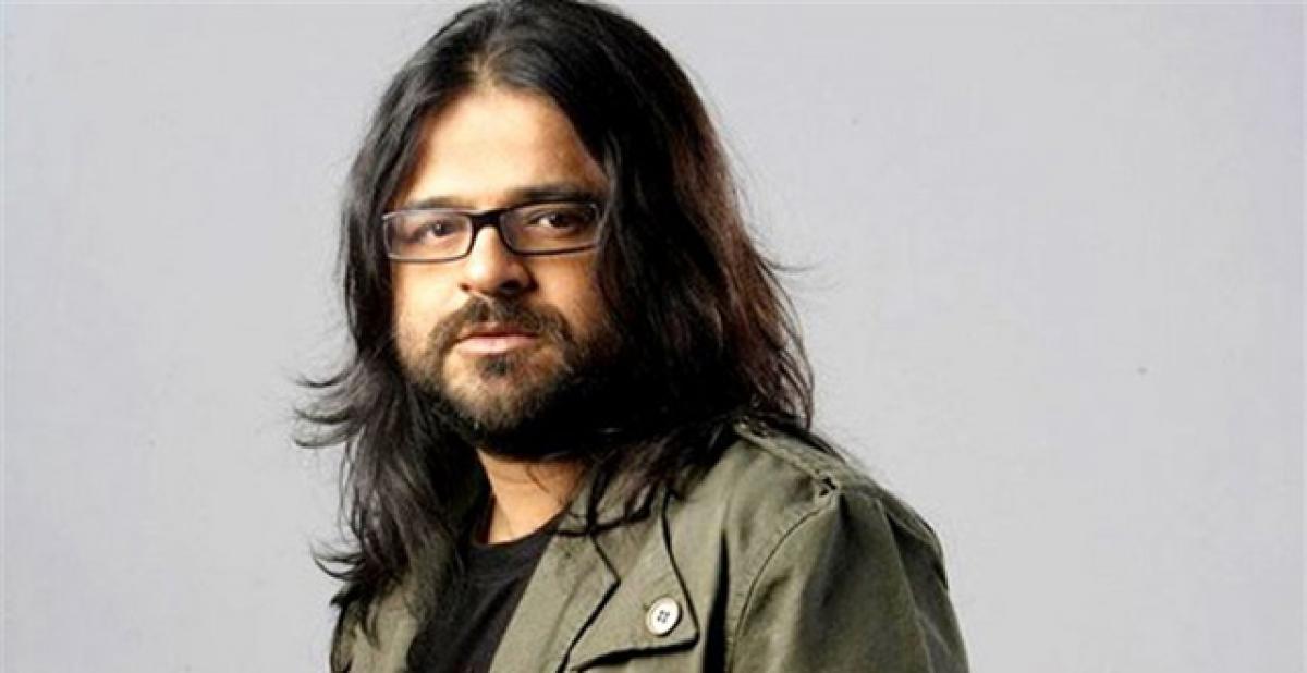 Pritam auctions guitar gifted by Shah Rukh Khan