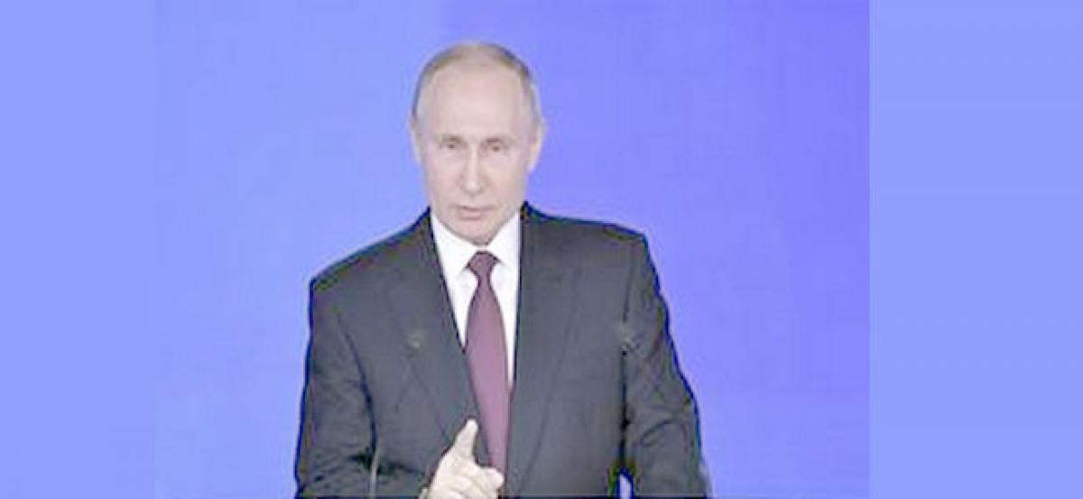 Putin heads for landslide victory, thanks supporters