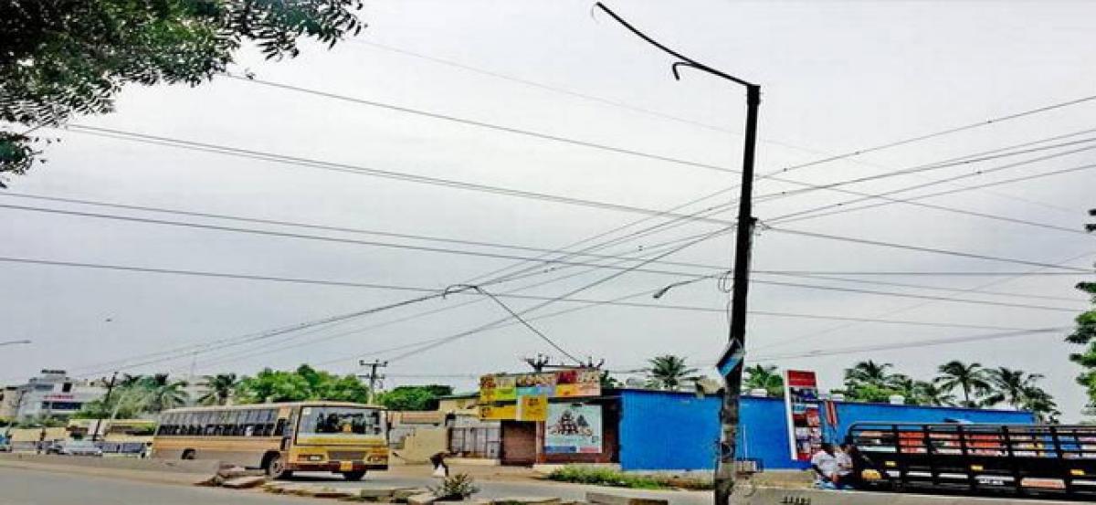 Dangling wires pose threat to motorists
