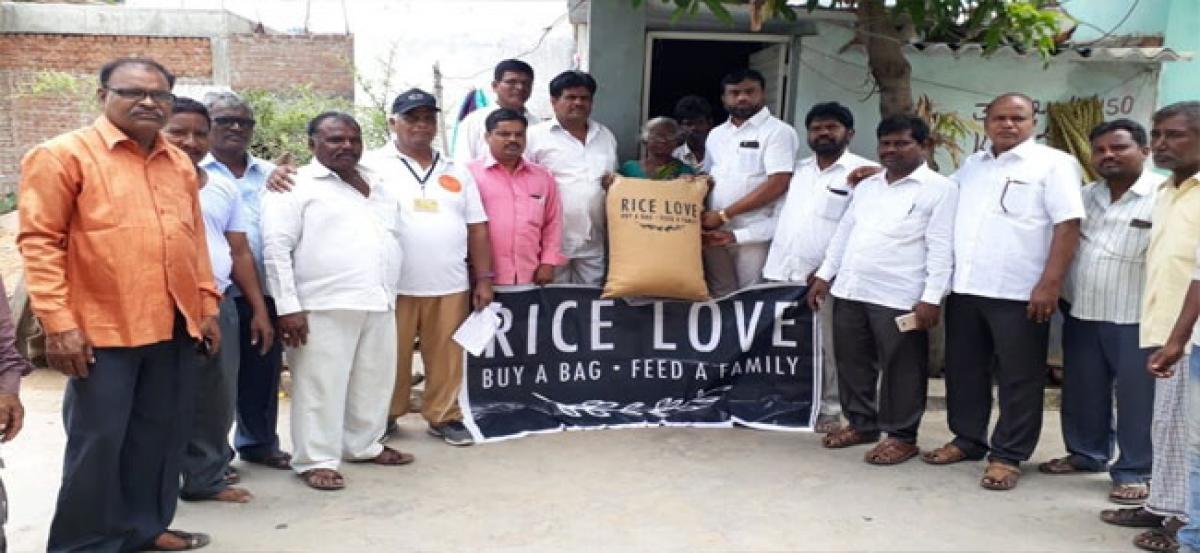 Corporator Golluri Anjaiah distributes rice bags to 250 families