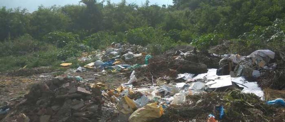 Commuters face hardships as rains sweep garbage on to main road