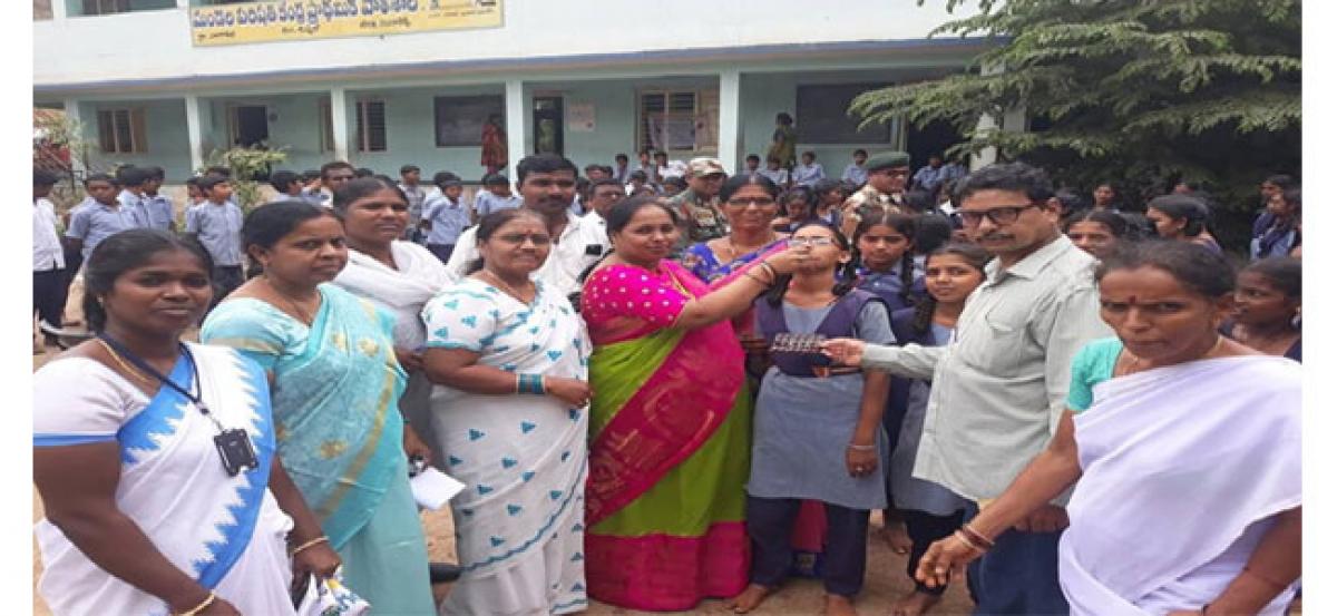 Corporator Sangeetha administers de-worming tablets to students