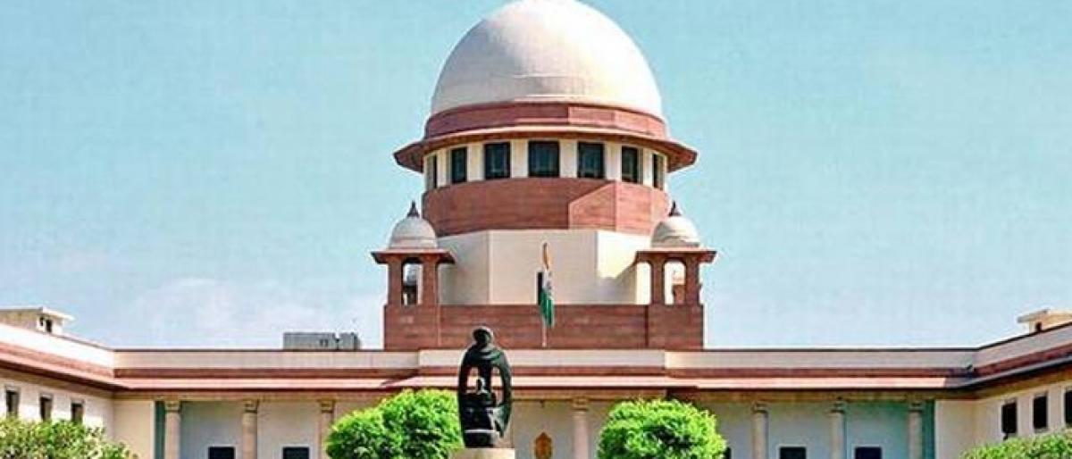 After hectic hearing, SC reserves Aadhaar verdict