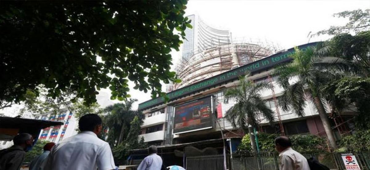 Sensex, Nifty trade lower on weak global cues, TCS shares jump over 6%