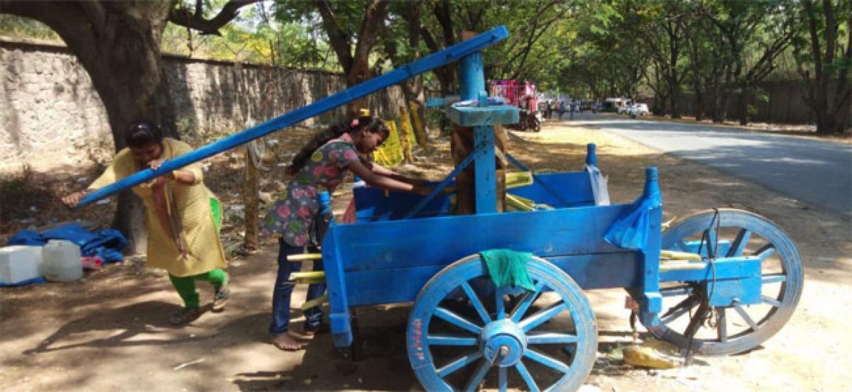 Sisters strive to make a living selling sugarcane juice