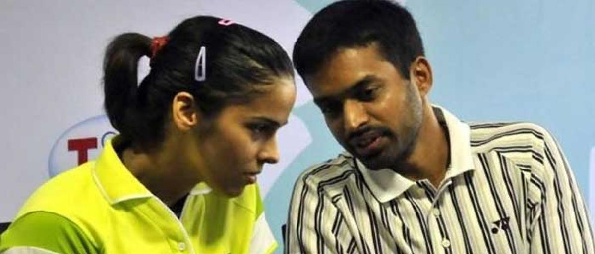 Saina reunites with Pullela Gopichand