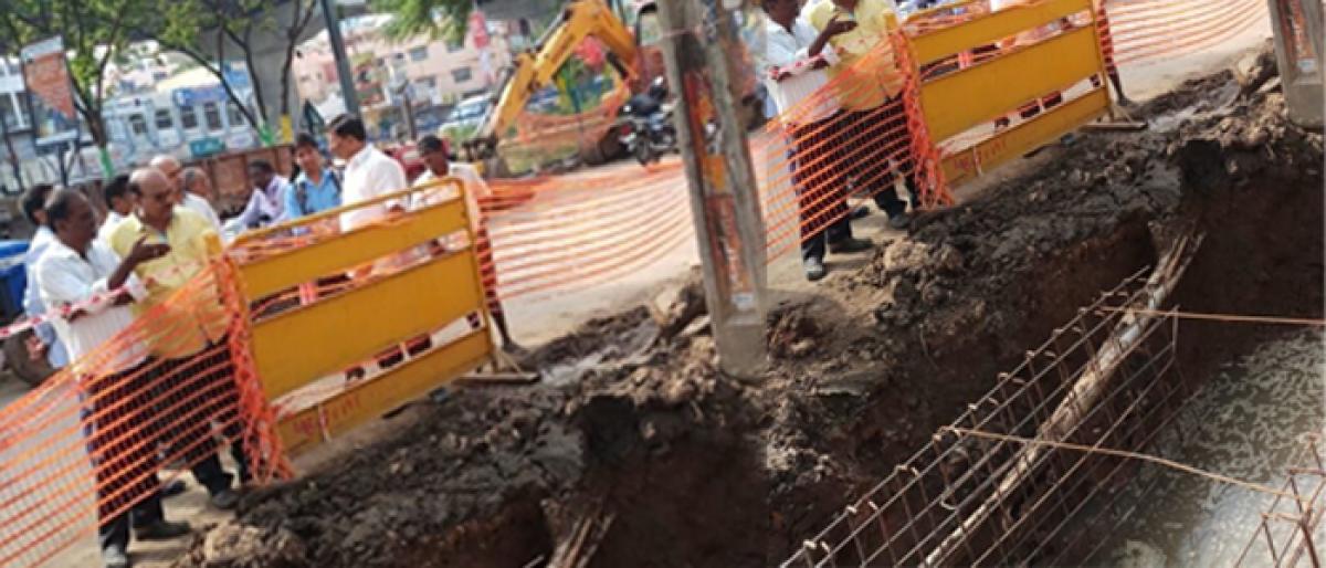 Delay in road widening hampers stormwater drain works in city
