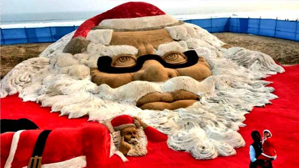 Sand artist Sudarsan Pattnaik attempts world record with biggest Santa Claus face on Puri beach