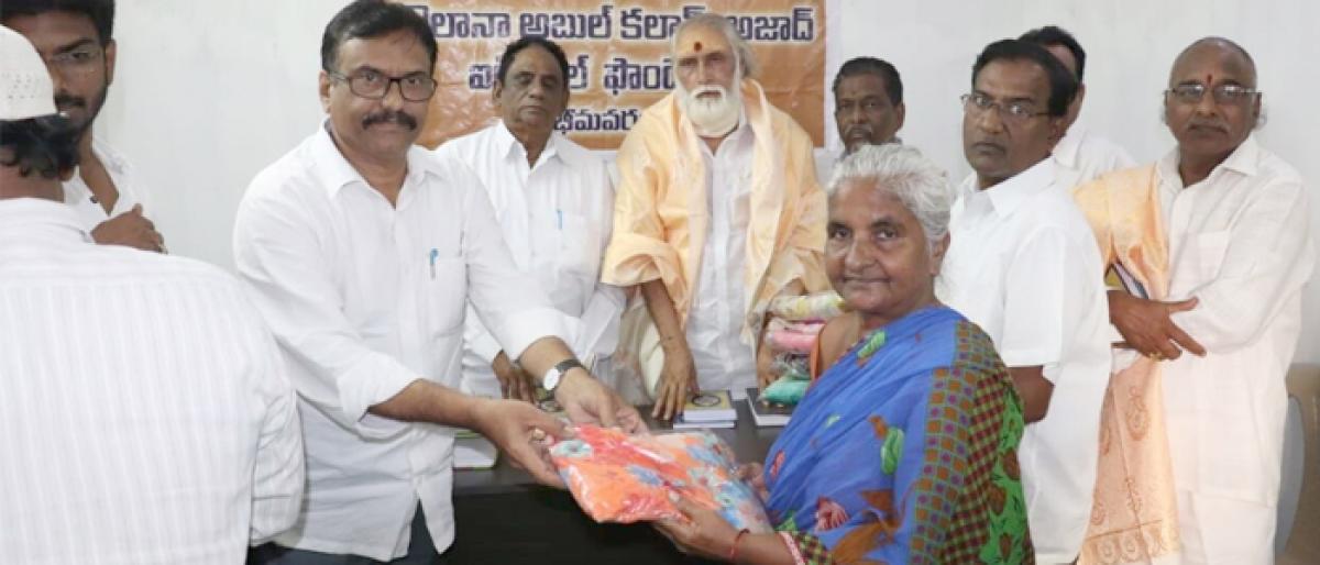 Scholarships, saris distributed in Bhimavaram