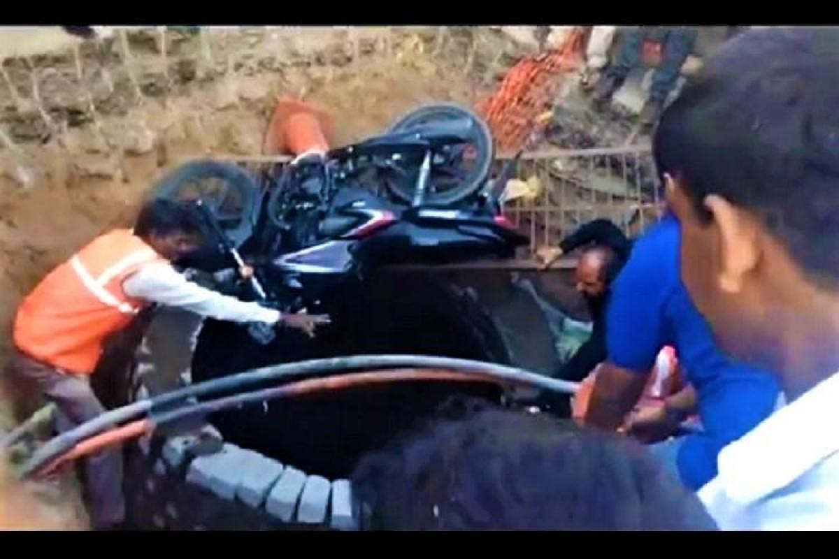 Viral video: Biker rescued after falling into huge pit opposite Secretariat