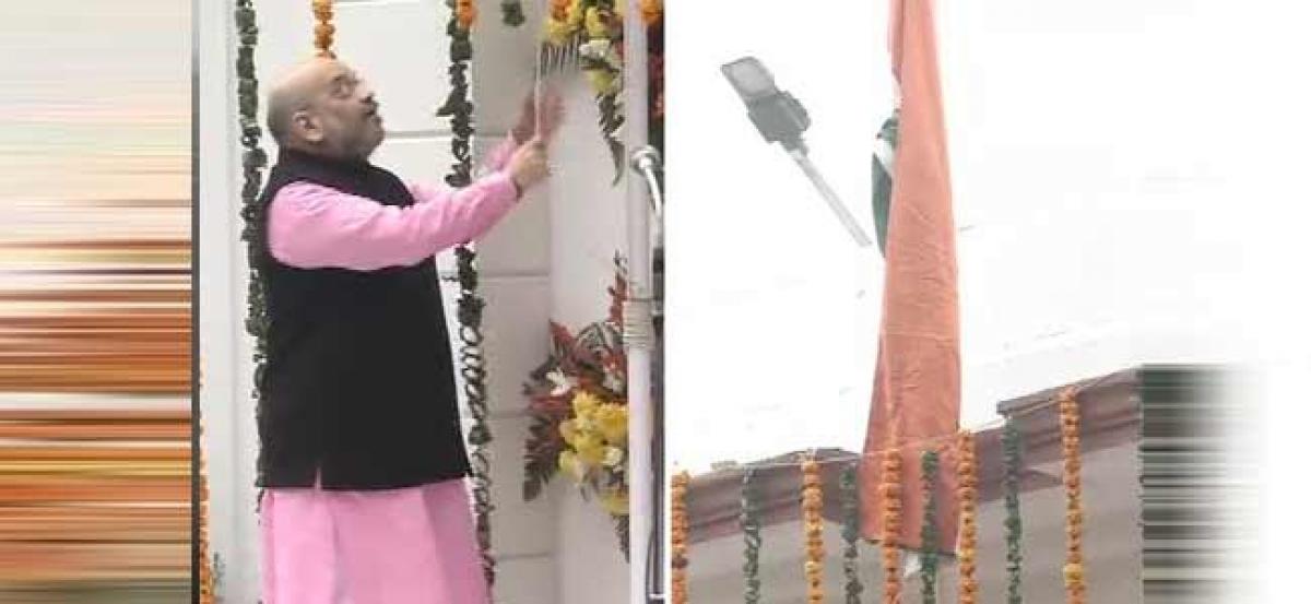 Amit Shah unfurls tricolour at BJP HQ