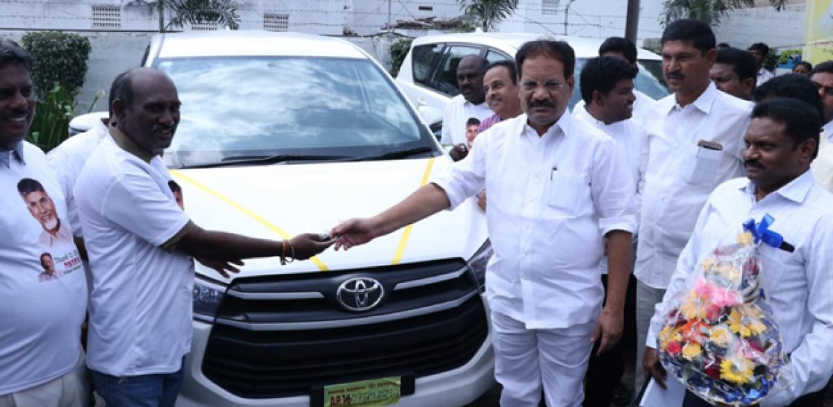 Minister Nakka Anand Babu distributes Innova cars to ST beneficiaries