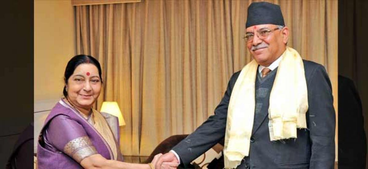 Sushma Swaraj meets Prachanda and other Nepalese leaders to discuss ways to enhance bilateral ties