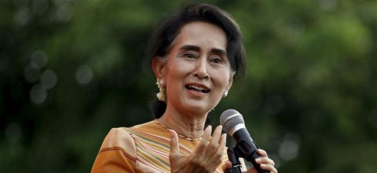 Myanmars Suu Kyi urges unity, creates new aid committee