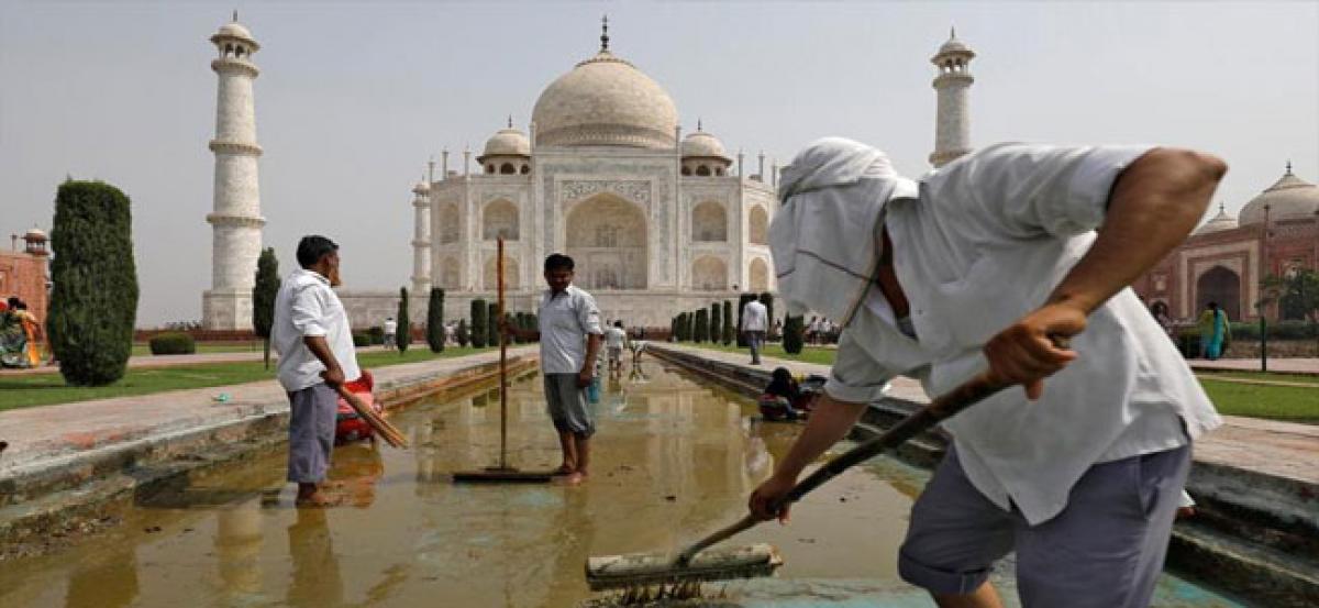 Pollution, insect excrement turning Taj Mahal yellow and green