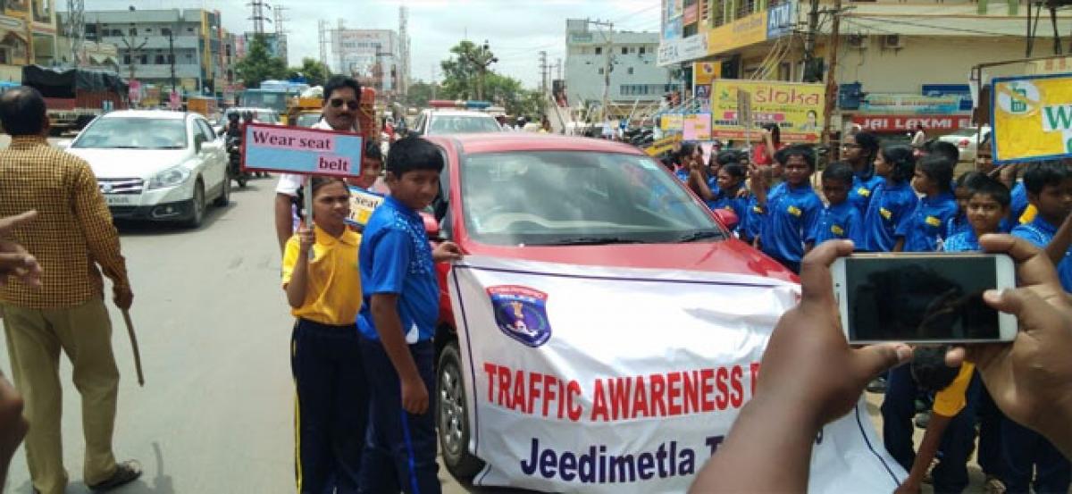 Students take part in traffic awareness programme at Gandimaisamma Crossroads