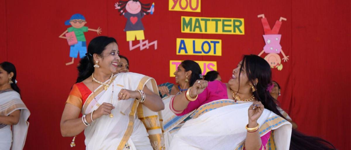 Teachers perform for children