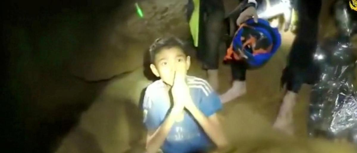 All 12 boys, football coach rescued from Thai cave