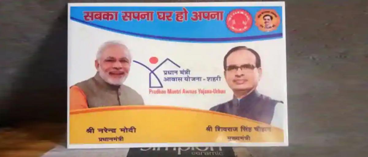 Tiles with photographs of PM and CM of Madhya Pradesh removed from PMAY houses