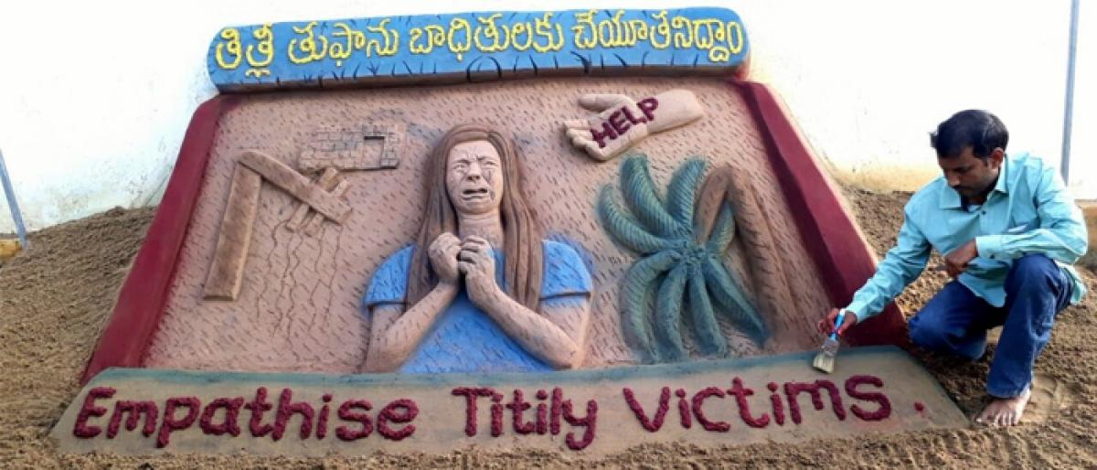 Sand sculpture seeking aid for Titli victims