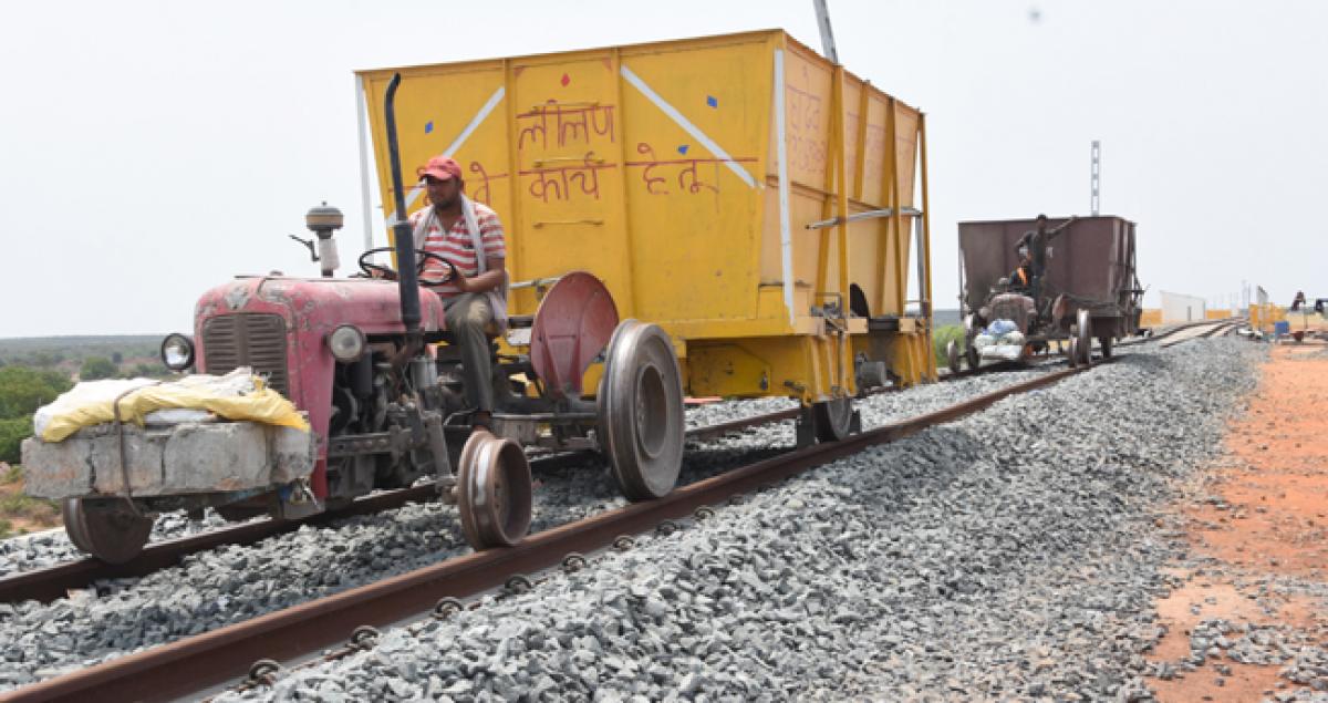 Jugaad idea makes trucks and tractors lay rail line