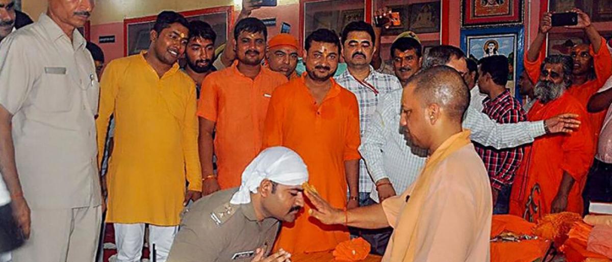 Cop bows to UP CM Yogi, triggers controversy