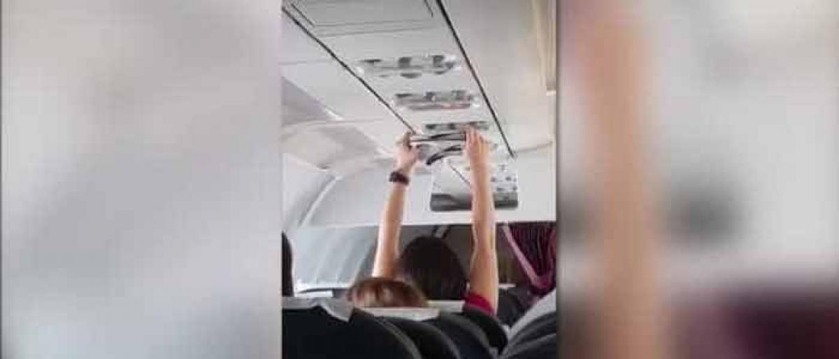 Woman spotted drying underwear on plane