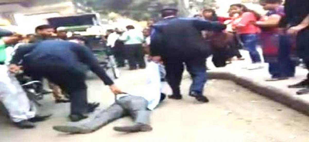 Viral video shows two traffic cops thrashing man