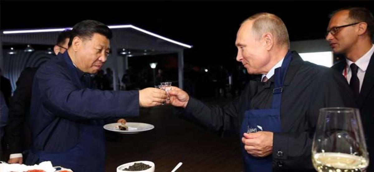 Watch: Ahead of war games, Masterchefs Putin and Xi put on apron, flip pancakes and drink vodka