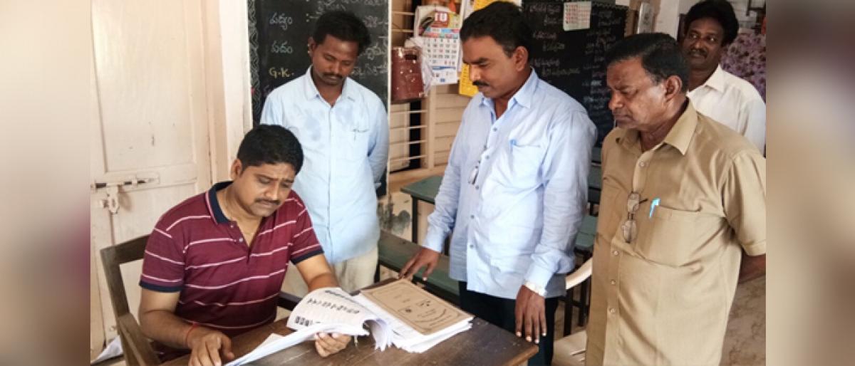 Voters verify names at special counters in Akiveedu