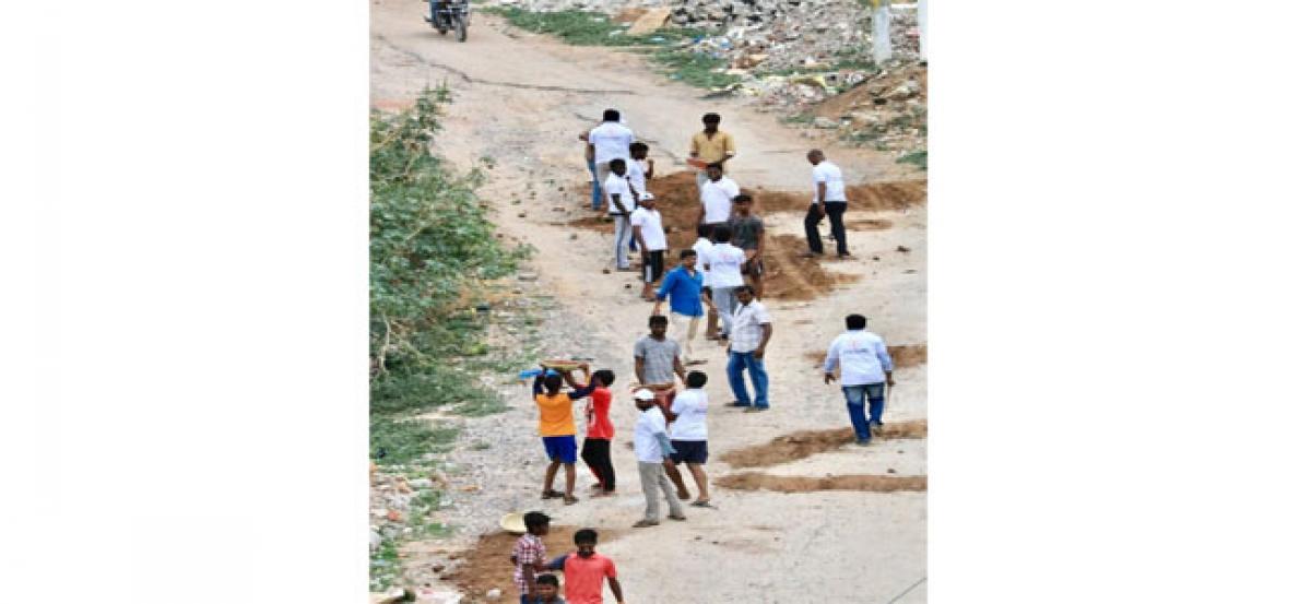 NGO repairs road in Film Nagar