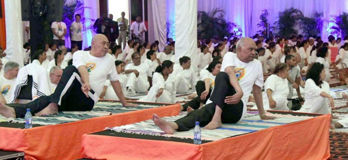 President Ram Nath Kovind performs asanas as people across the world celebrate Yoga Day