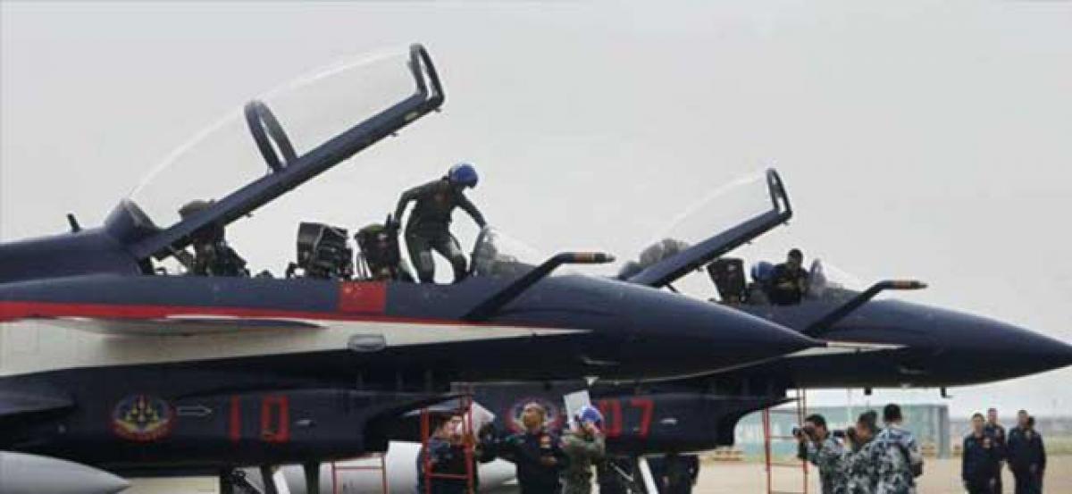 Chinese aircraft circles Taiwan in latest military drill