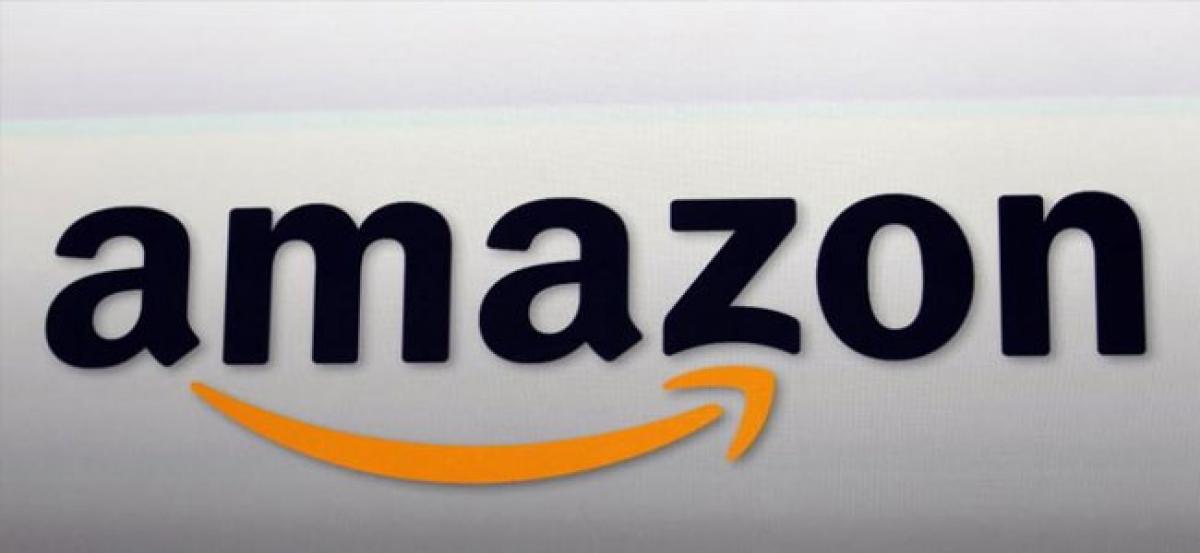 Amazon.coms stock market value hits USD 900 billion, threatens Apple
