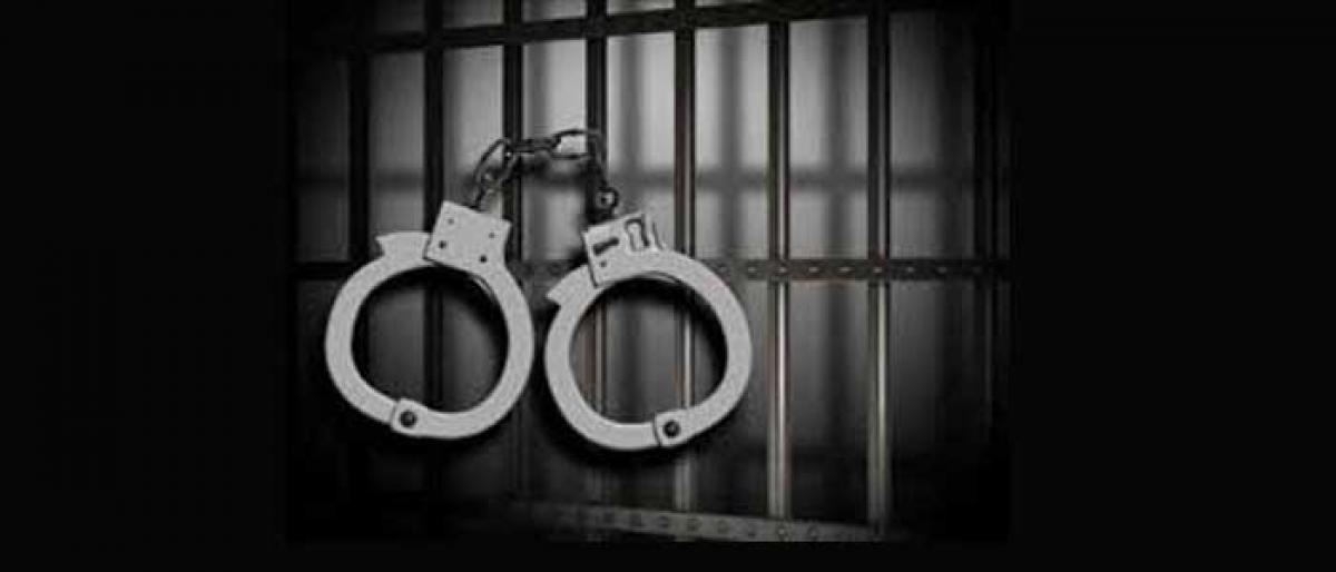 Man, son held for thrashing biker