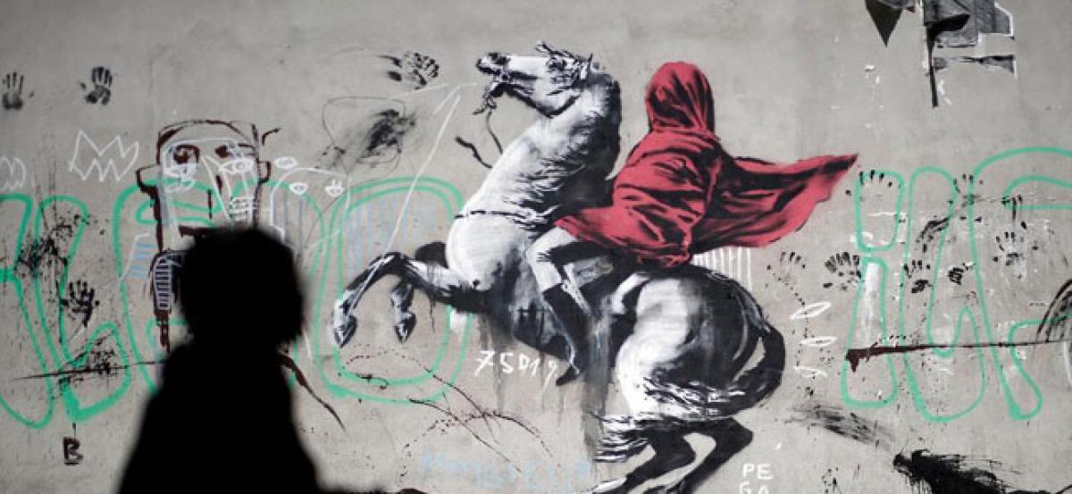 Banksy’s new murals in Paris target France’s policy on migrants