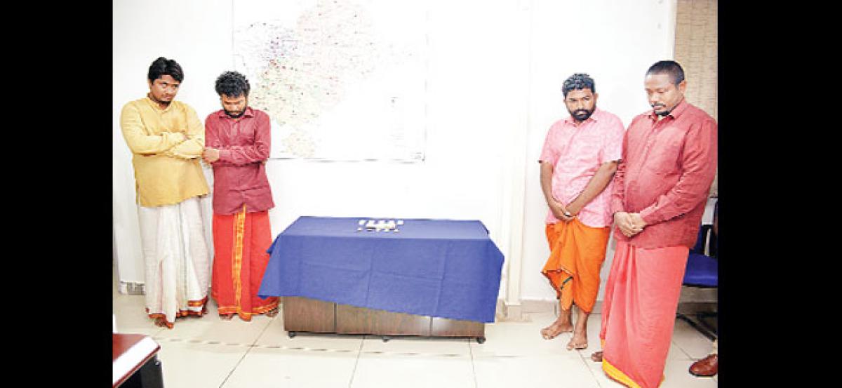 Four fake babas held for extortion