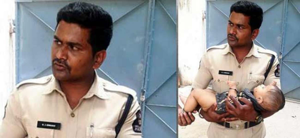 Hyderabad Cops console baby while mother takes Group IV exam
